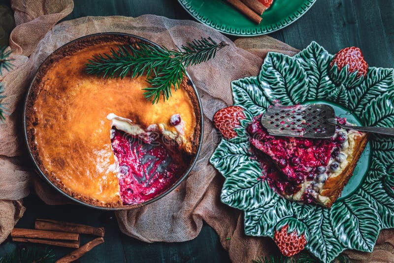 Traditional homemade french cake with cranberries served on green wooden table. Top view.High quality photo. Traditional homemade french cake with cranberries served on green wooden table. Top view.High quality photo