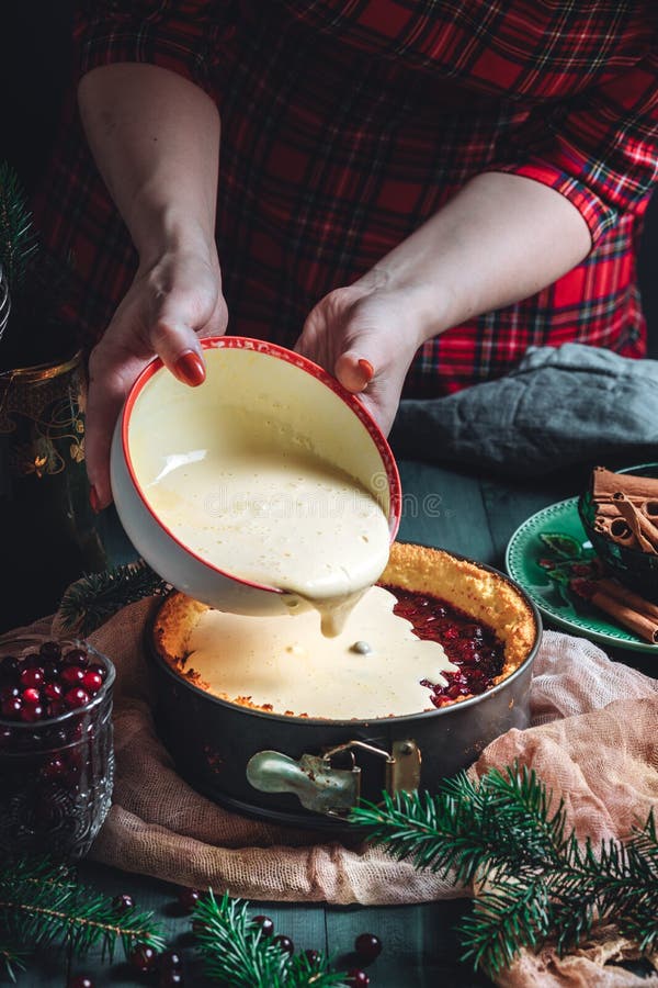 Traditional homemade french cake with cranberries served on green wooden table, cooking process. High quality photo. Traditional homemade french cake with cranberries served on green wooden table, cooking process. High quality photo