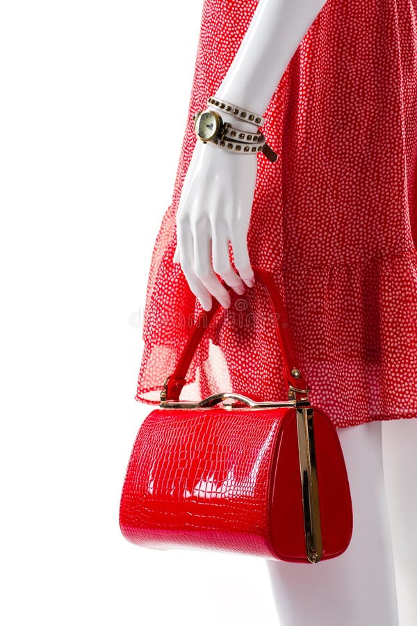 Bolsa vermelha na mão do manequim fotografia de stock Bolsa vermelha na mão do manequim fotografia de stock