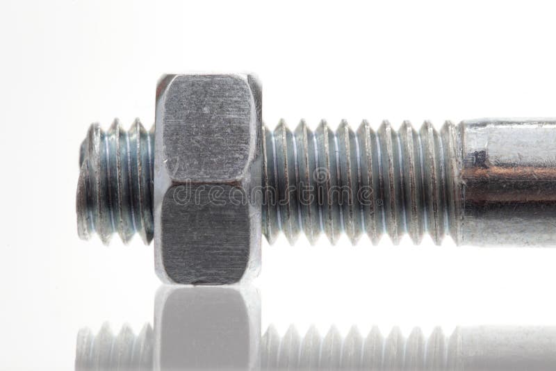 Bolt with nut, closeup stock photography