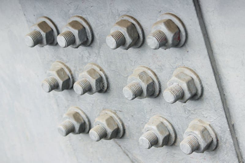 Huge Bolts And Nuts Together In A Flange Fastening A Giant Pole Stock
