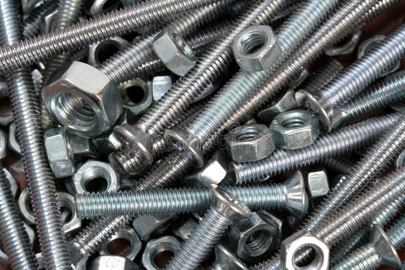 Small steel nuts and bolts stock image. Image of bolts 28865401