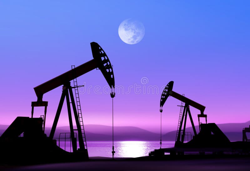 Bombas de petróleo en la noche fotografía de archivo