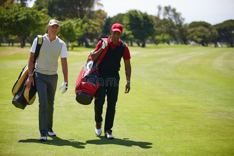 Bonding on the Green. Two Men Carrying Their Golf Bags Across a Golf ...