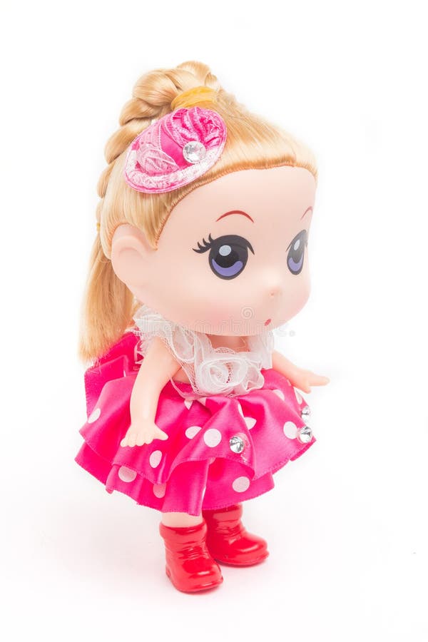 Boneca em um vestido cor-de-rosa fotografia de stock Boneca em um vestido cor-de-rosa fotografia de stock