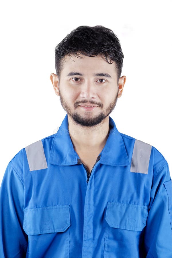 Bonito aspecto mecánico y sonriente en la cámara foto de archivo