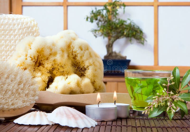 Spa bath products, green tea and bonsai tree against a traditional japanese shoji sliding window. Spa bath products, green tea and bonsai tree against a traditional japanese shoji sliding window