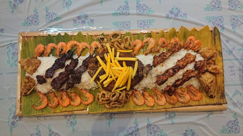 Boodle Fight Filipino traditional food preparation based on military practice of eating.