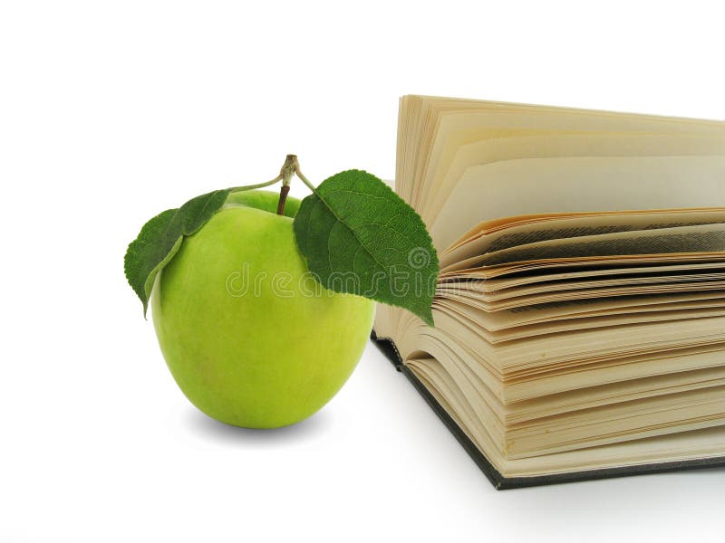 Book and green apple