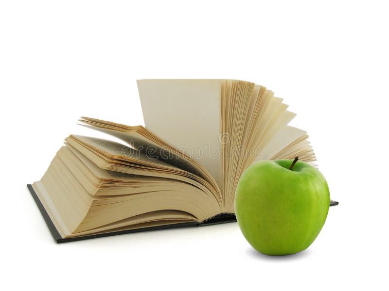 Book and green apple