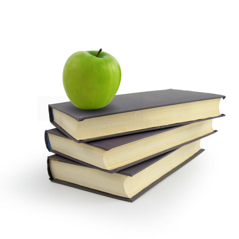 Book and green apple