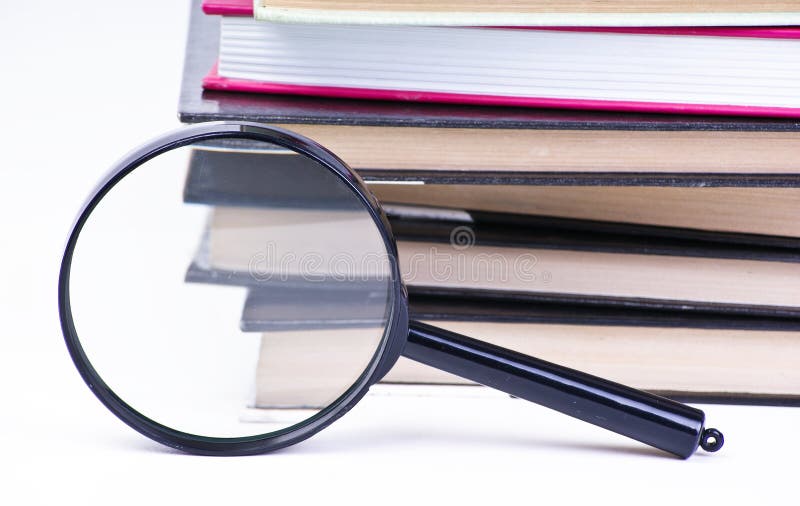 Book with magnifying glass