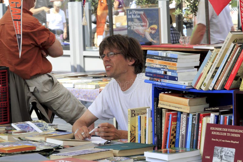 Book seller on the market editorial image. Image of biggest 15034295