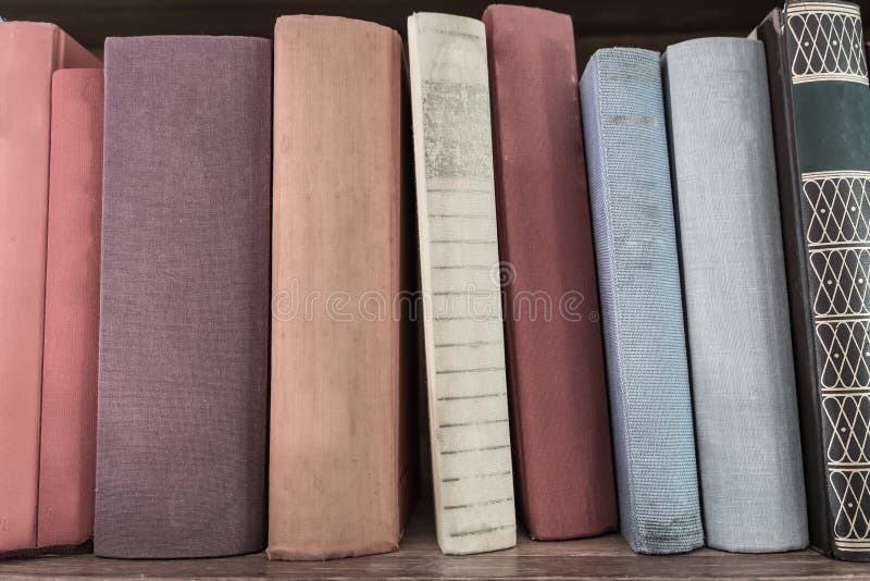 Book stack on wood shelf