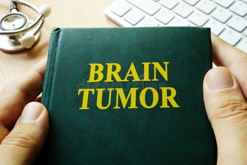 Book with title brain tumor. stock photos