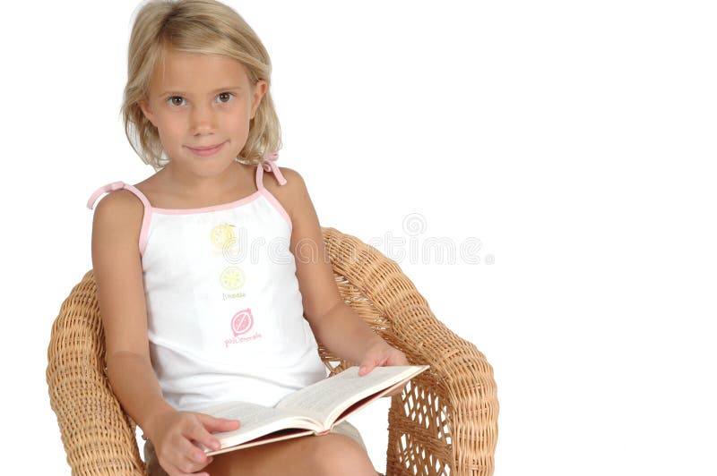 Read: to look at carefully so as to understand the meaning of. Child reading a book in a chair isolated on white background. Reading broadens the mind. Read: to look at carefully so as to understand the meaning of. Child reading a book in a chair isolated on white background. Reading broadens the mind.