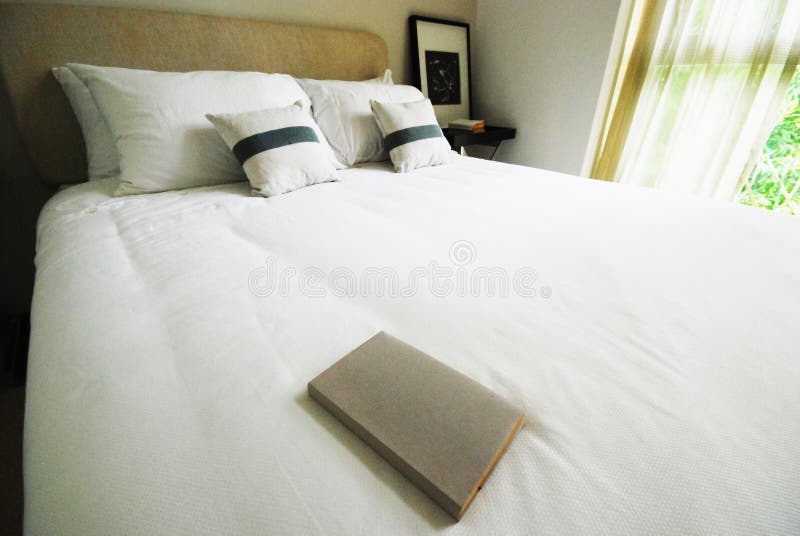 Book on white bed