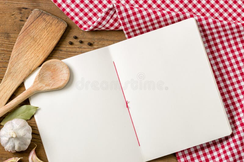 Empty book with wooden spoons on a red checkered tablecloth. Vintage rustic recipe book background stock images, royalty-free photos and pictures
