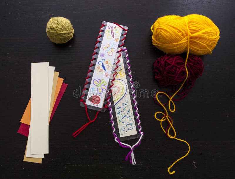 Bookmark for books, Art and handswork for children with woolen threads stock photography