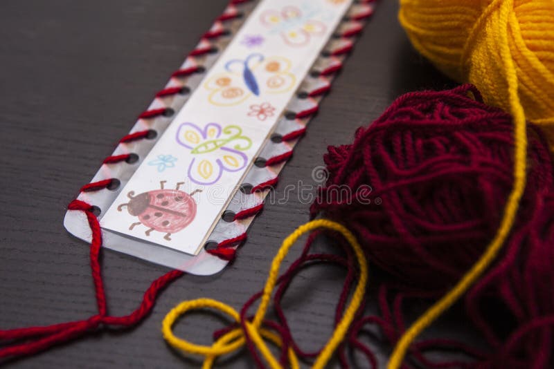 Bookmark for books, Art and handswork for children with woolen threads stock photography