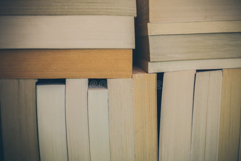 Books background for design. Many books piled together. Education and wisdom. stock photography