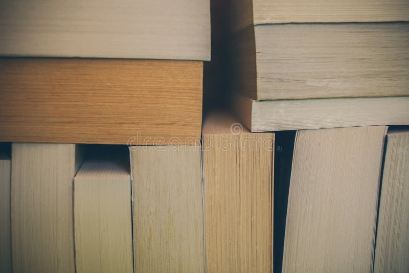 Books background for design. Many books piled together. Education and wisdom. royalty free stock image