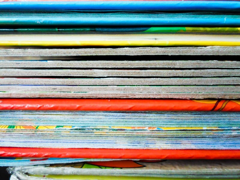 Books With Colorful Covers Lined Up On A Bookshelf Bright