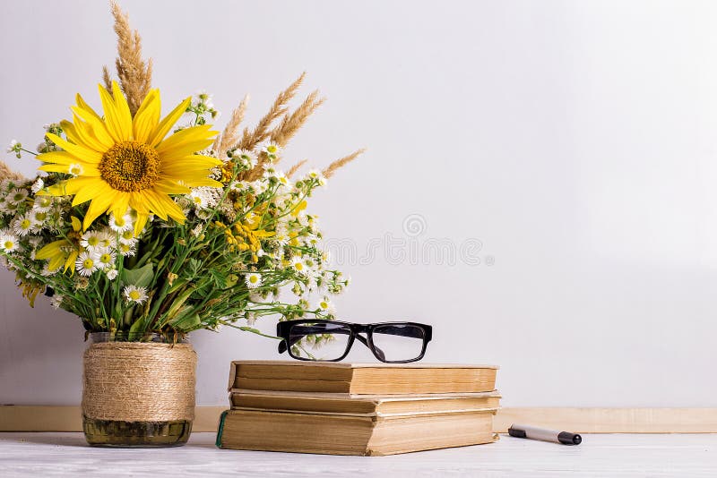 Books, Glasses, Markers and a Bouquet of Flowers in a Vase on White Board  Background. Concept for Teachers Day and First September Stock Image -  Image of chalkboard, school: 155562073