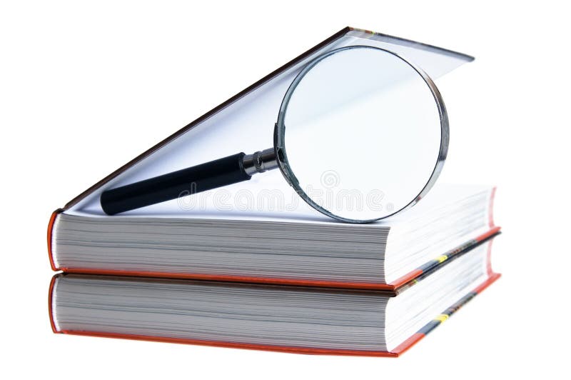 Books with magnifying glass stock photography