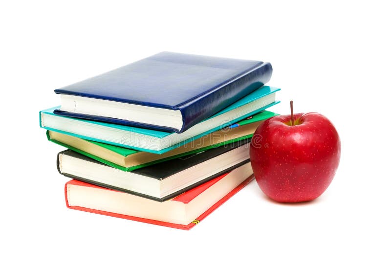 Books and a red apple on a white background