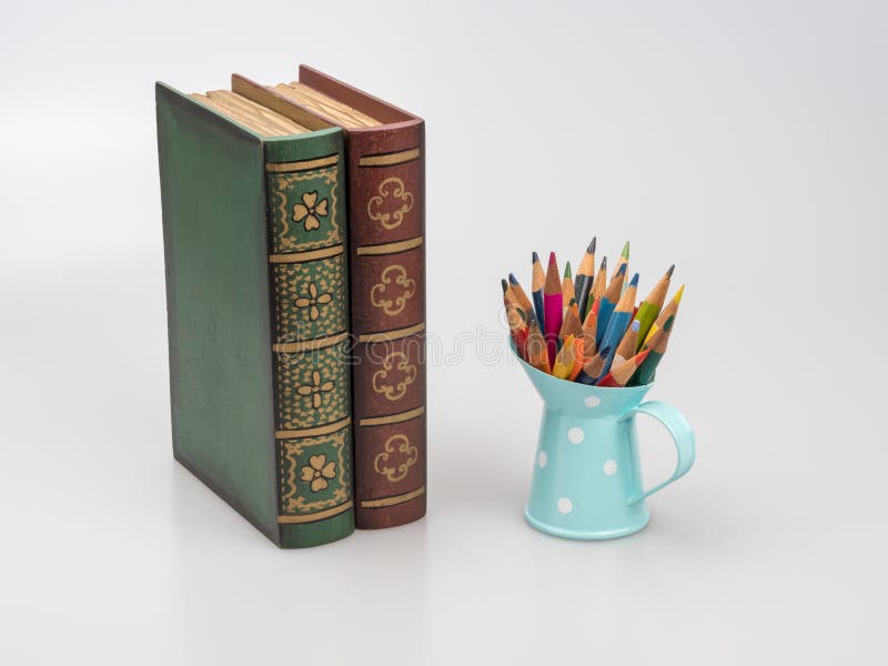 Books and Sharpened Miniature Pencils in the Pencil Holder. White