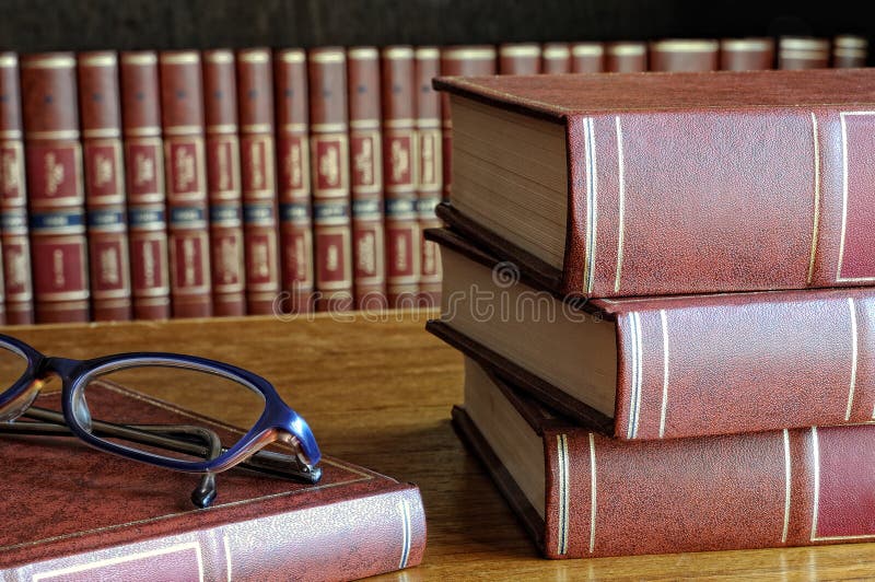 Books on the table and glasses