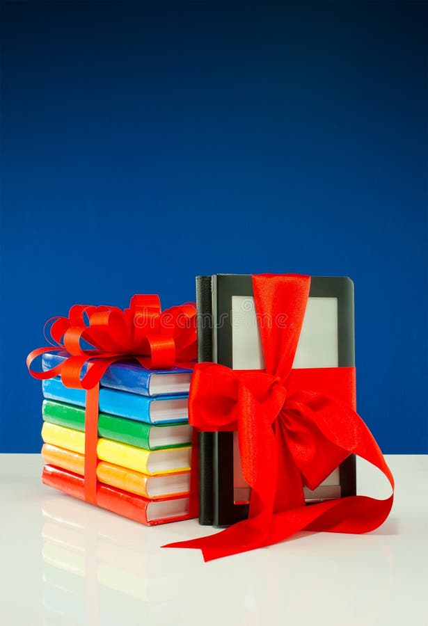 Books tied up with ribbon and e-book reader