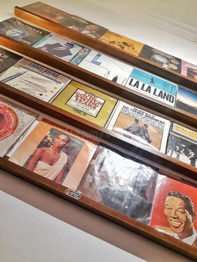 Bookshelf Full with Vinyl Record in Corner of the Room Editorial