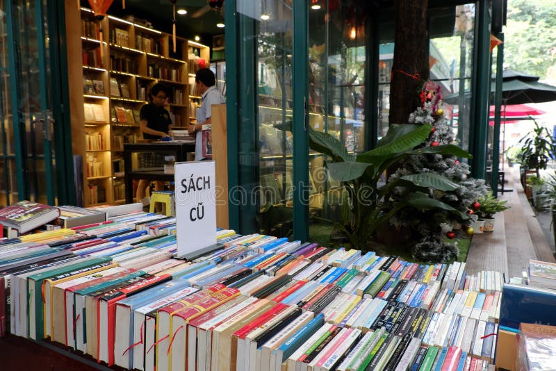 HO CHI MINH CITY, VIET NAM- DEC 1, 2017: Books street with many bookstore at center of city, publishing company show colorful books outdoor of shop, reading culture decrease in modern society, Vietnam. HO CHI MINH CITY, VIET NAM- DEC 1, 2017: Books street with many bookstore at center of city, publishing company show colorful books outdoor of shop, reading culture decrease in modern society, Vietnam