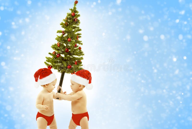 Boom van de Jonge geitjes de Huidige Kerstmis van de Kerstmisbaby, Kinderen Santa Hat royalty-vrije stock fotografie Boom van de Jonge geitjes de Huidige Kerstmis van de Kerstmisbaby, Kinderen Santa Hat royalty-vrije stock fotografie