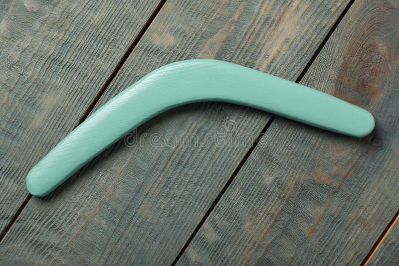 Boomerang on Light Blue Wooden Background, Top View Stock Photo Image