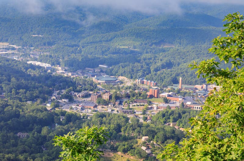 View of Boone, North Carolina town from high at Howards Knob Overlook as fog lifts from the valley. View of Boone, North Carolina town from high at Howards Knob Overlook as fog lifts from the valley.