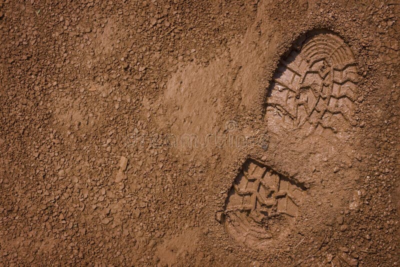 Imprint of the shoe on mud with copy space. Imprint of the shoe on mud with copy space