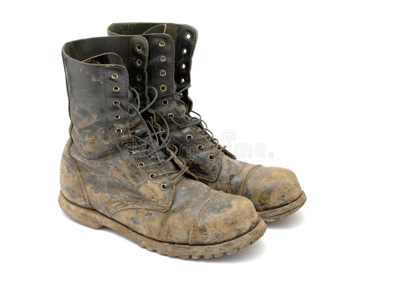 Muddy boots isolated on white background