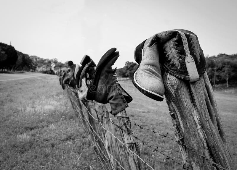 Boots on a fence stock image. Image of shoes, hill, boots 64926459