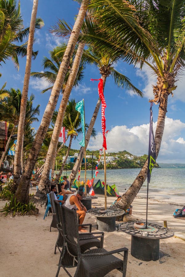 BORACAY, PHILIPPINES - FEBRUARY 3, 2018: Palms at the Bulabog Beach on Boracay island, Philippines. BORACAY, PHILIPPINES - FEBRUARY 3, 2018: Palms at the Bulabog Beach on Boracay island, Philippines