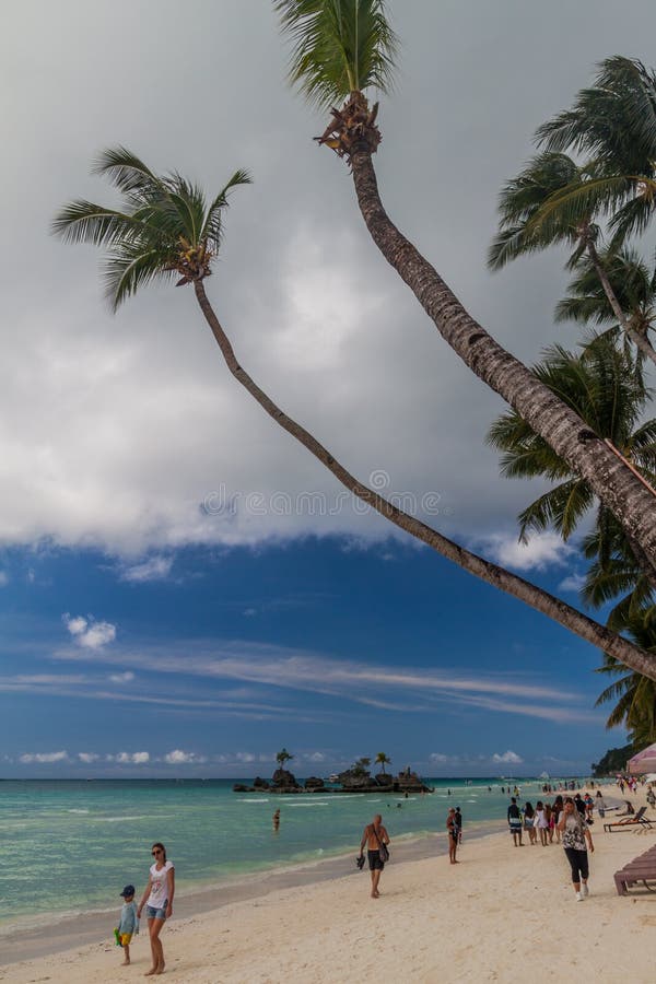 BORACAY, PHILIPPINES - FEBRUARY 3, 2018: Palms at the White Beach on Boracay island, Philippines. BORACAY, PHILIPPINES - FEBRUARY 3, 2018: Palms at the White Beach on Boracay island, Philippines