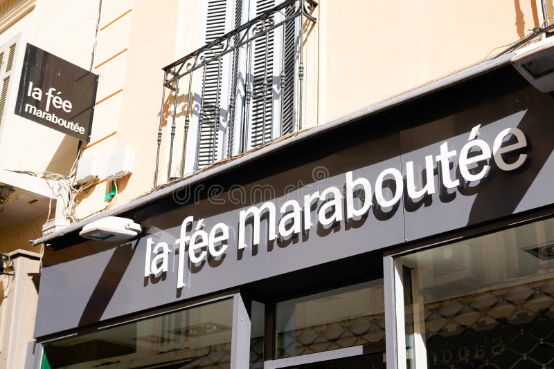 La Féé Maraboutée Sign Text and Logo Brand on Facade Store Wall ...