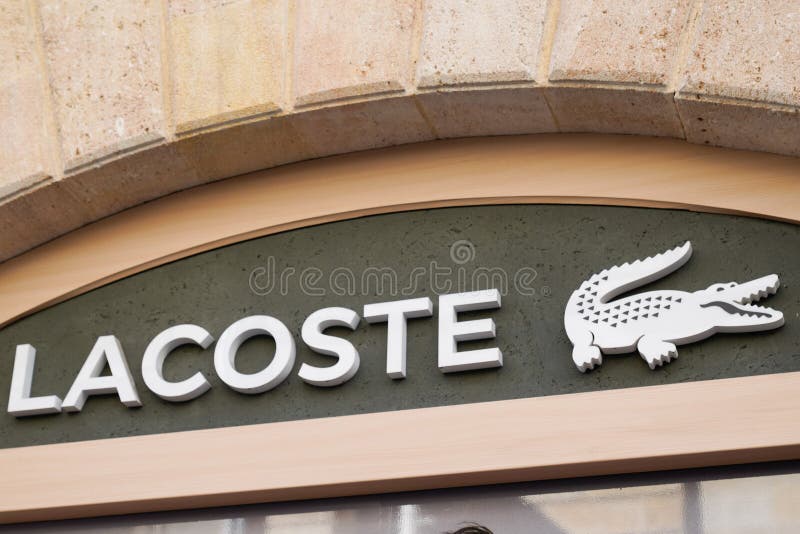 is lacoste a designer brand