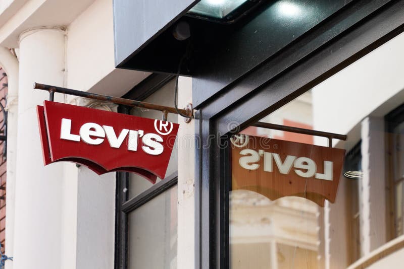 Levi`s Logo Red Sign and Text Front of Jeans Levis Store of Clothing  Fashion Levi Editorial Photography - Image of glasses, illustrative:  195566752