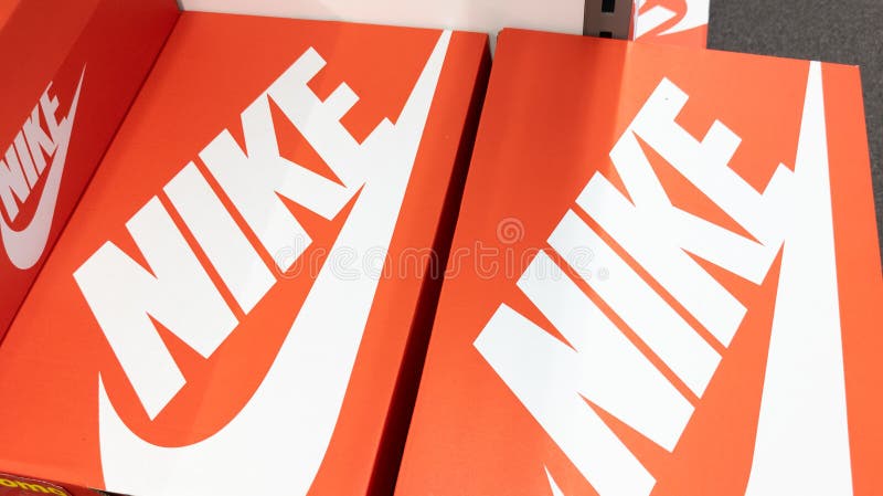 Nike Sign Text and Brand Logo on Red Boxes of Shoes Sportswear in Store ...