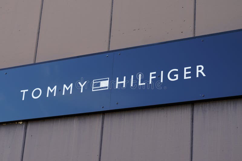 Tommy Hilfiger Sign Flag And Text Logo Store Front Of American Clothing ...