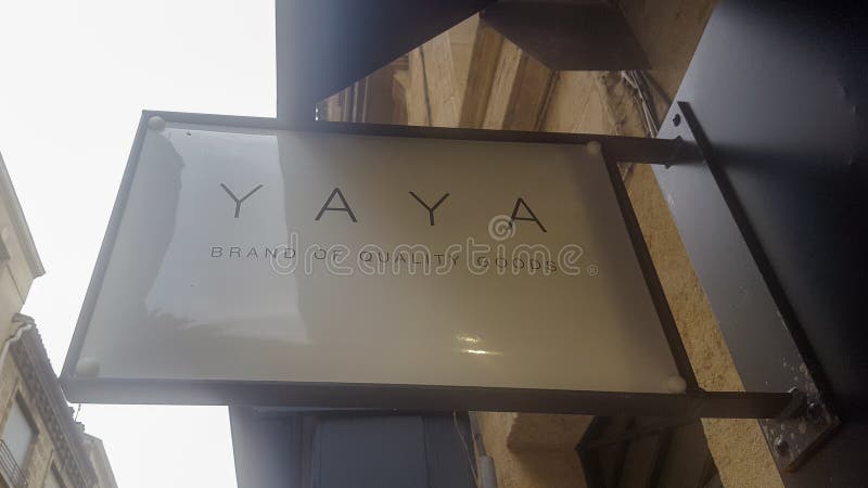 YAYA Sign Text and Logo Brand Front of Trendy Store Feminine Clothing ...