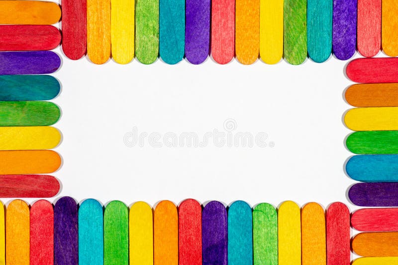 Border of colored lollipop sticks with blank white interior